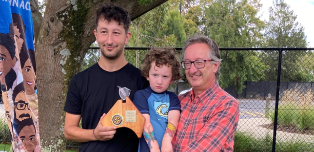 Jack receiving his award with dad Ben and younger brother Gus