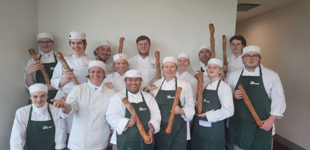 Students show off their breadmaking masterclass products