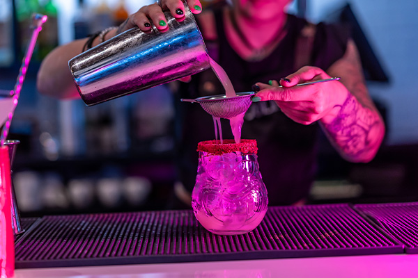 Bar tender mixing a cocktail