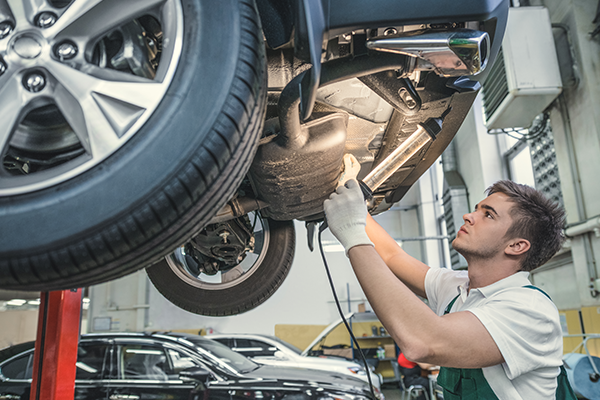 mechanic working on car