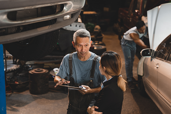 Mechanic talking to customer